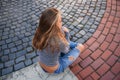 Young teenage poses to photographer. blonde girl in jeans and blouse Royalty Free Stock Photo