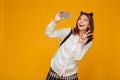 Young teenage schoolgirl in uniform with backpack Royalty Free Stock Photo