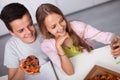 Young teenager boy and girl study together - eating pizza