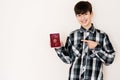 Young teenager boy holding Peru passport looking positive and happy standing and smiling with a confident smile against white Royalty Free Stock Photo