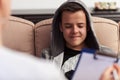 Young teenager boy sitting at counseling, close up Royalty Free Stock Photo