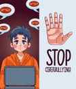 young teenager boy using laptop with stop cyber bullying lettering