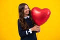 Young teenager child girl with heart balloon. Happy Valentines Day. Love and pleasant feelings concept. Royalty Free Stock Photo