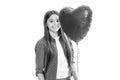 Young teenager child girl with heart shape balloon. Happy Valentines Day. Love and pleasant feelings concept. Portrait Royalty Free Stock Photo