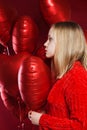 Young teenager girl with balloons red heart Royalty Free Stock Photo