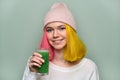 Young teenager girl with green vegetable smoothie drink