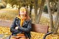 Young teenager girl relaxing and meditating in autumn park Royalty Free Stock Photo