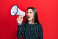 Young teenager girl shouthing and screaming with megaphone Royalty Free Stock Photo