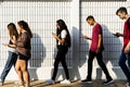 Young teenager looking into their phone Royalty Free Stock Photo