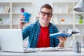 The young teenager preparing for exams studying at a desk indoors Royalty Free Stock Photo