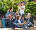 Teenagers friends playing musical instruments Royalty Free Stock Photo