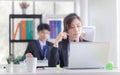 Young telephone operator with headset, Customer service executive team working at office Royalty Free Stock Photo