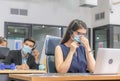 Young telephone operator with headset wear protection face mask against coronavirus, Customer service executive team working at