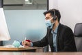 Young telephone operator with headset wear protection face mask against coronavirus, Customer service working at office