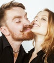 Young tender couple, man and woman in love isolated on white close up kissing smiling fooling around Royalty Free Stock Photo