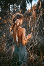 Young and tender woman on a feild at sunset portrait Royalty Free Stock Photo