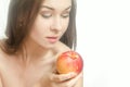 Young tender woman with a peach in her hand Royalty Free Stock Photo