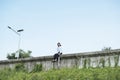 Young thai asian woman sitting on the wall