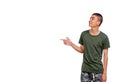 Young Thai man points to his right side copyspace Royalty Free Stock Photo