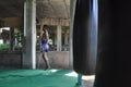 A young Thai Muay Thai fighter jumps the cord at a boxing gym under a bridge in Minburi, Thailand