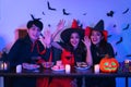 Young Thai People in Costumes Celebrating Halloween. Group of Young Happy Friends Wearing Halloween Costumes having Fun at Party Royalty Free Stock Photo