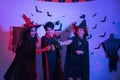 Young Thai People in Costumes Celebrating Halloween. Group of Young Happy Friends Wearing Halloween Costumes having Fun at Party Royalty Free Stock Photo