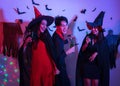 Young Thai People in Costumes Celebrating Halloween. Group of Young Happy Friends Wearing Halloween Costumes having Fun at Party Royalty Free Stock Photo