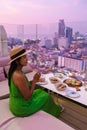 young women having a drink on a rooftop bar Royalty Free Stock Photo