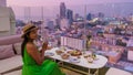 young women having a drink on a rooftop bar Royalty Free Stock Photo