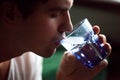 Young thirsty dehydrated man drinking water quenching thirst, cl Royalty Free Stock Photo