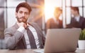 Young thoughtful business man executive manager wearing suit working in modern office Royalty Free Stock Photo