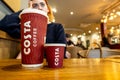 Young Thoughtful Woman Sitting In Costa Coffee Shop