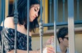 Young thoughtful woman sitting outdoors on home Royalty Free Stock Photo