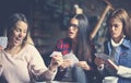 Three best friends in cafe playing together game cards. Cl Royalty Free Stock Photo