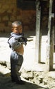 Young Tibetan boy at the side of the road