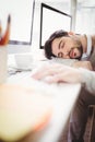 Young tired businessman taking nap in office Royalty Free Stock Photo