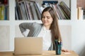 Young female office worker has back discomfort at work desk. Royalty Free Stock Photo