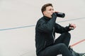 Young handsome man athlete resting at the stadium Royalty Free Stock Photo