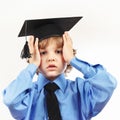 Young tired professor in academic hat on white background