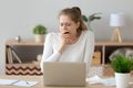 Young tired sleepy woman yawning working or studying with laptop Royalty Free Stock Photo
