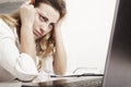 Young tired, stressed and frustrated businesswoman desperate working at office with laptop (Gestures, body language, psychology) Royalty Free Stock Photo