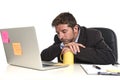 Young tired and wasted businessman working in stress at office laptop computer looking exhausted Royalty Free Stock Photo