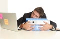 Young tired and wasted businessman working in stress at office laptop computer sleeping exhausted Royalty Free Stock Photo