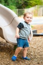 Young toddler boy child playing on slide