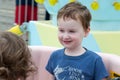 Young toddler boy having fun on boardwalk amusement ride Royalty Free Stock Photo