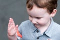 Young toddler boy having fun on boardwalk amusement ride Royalty Free Stock Photo