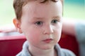 Young toddler boy having fun on boardwalk amusement ride Royalty Free Stock Photo