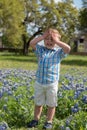 Young Boy in Field of Blue Bonnets Royalty Free Stock Photo