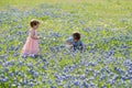 Young Children in Field of Blue Bonnet Flowers Royalty Free Stock Photo