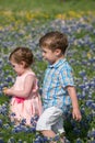 Young Children in Field of Blue Bonnet Flowers Royalty Free Stock Photo